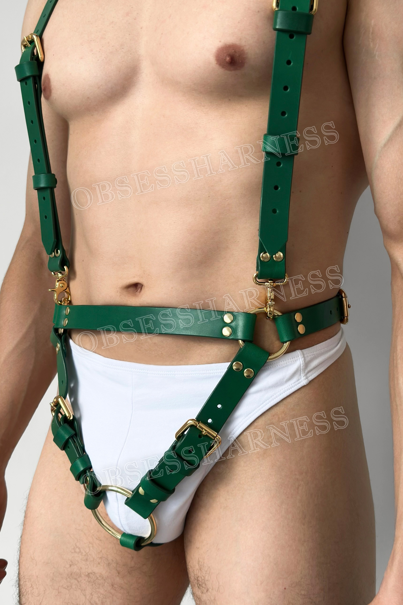 Cross body harness cock ring for a man's penis during sex and role-playing games