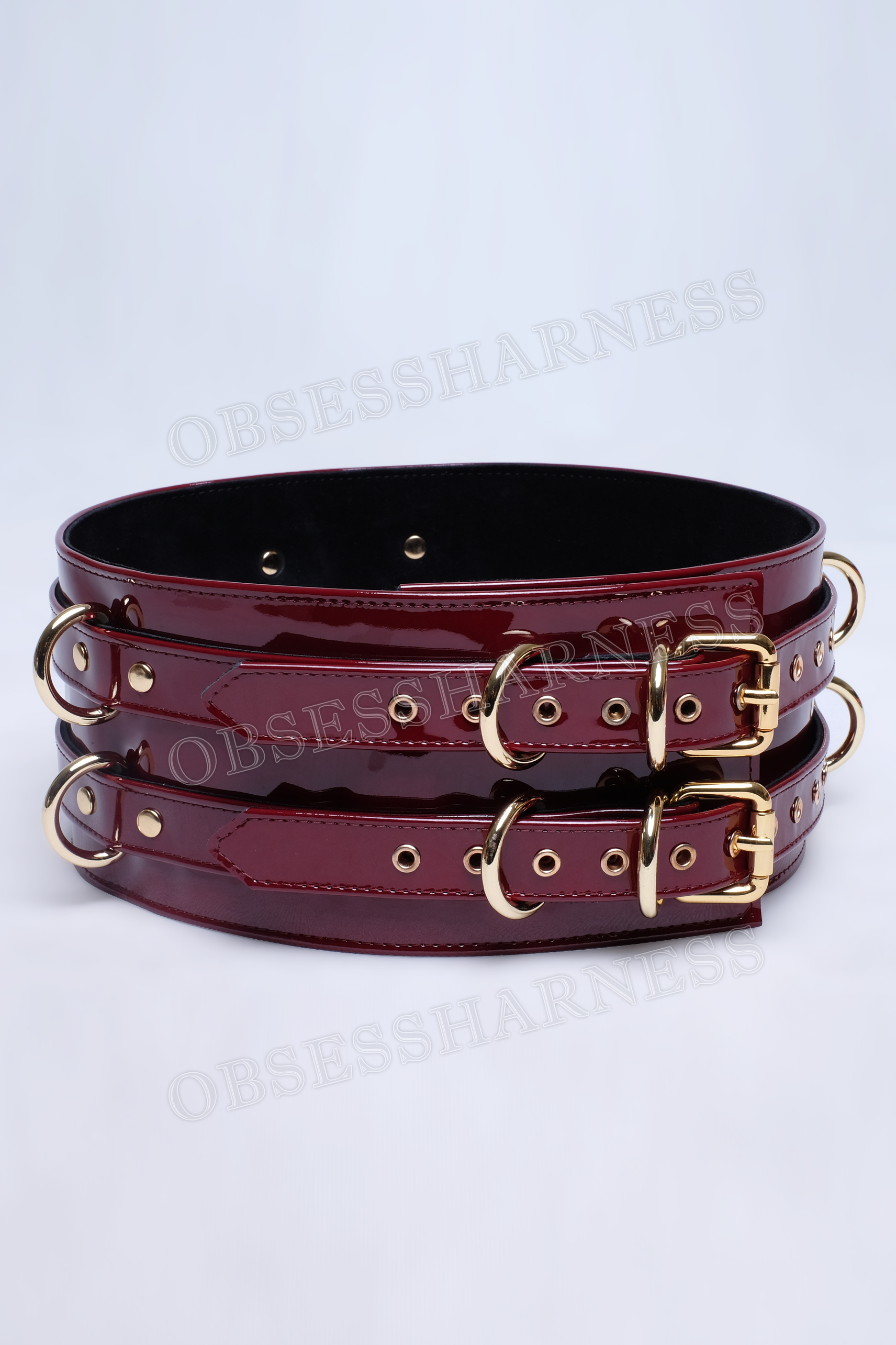 Belt bondage harness premium made of genuine patent leather with double fasteners at the waist and additional D-rings on the sides and back for attaching BDSM restraints to the submissive for role-playing games