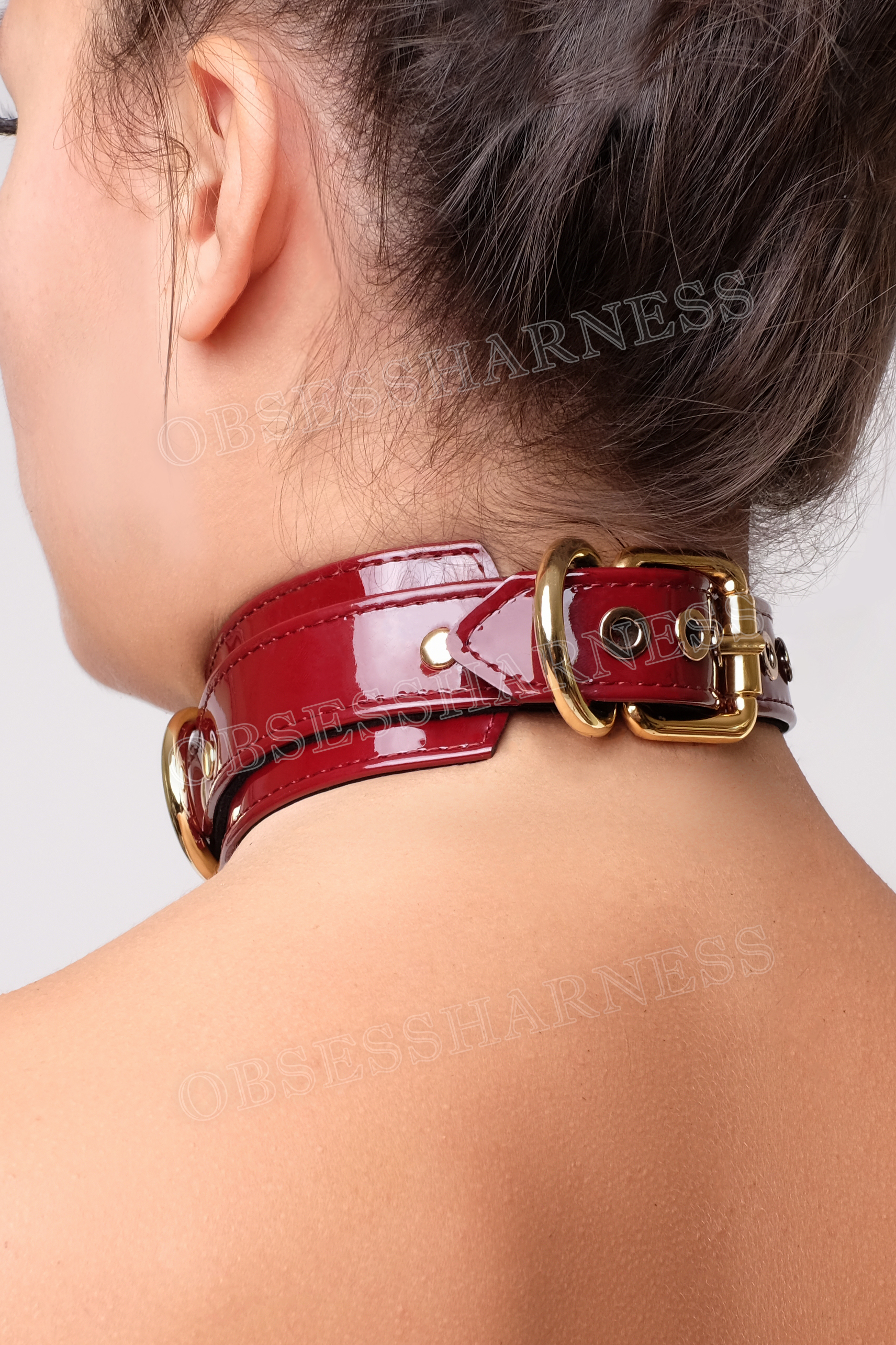 collar choker  women with a clasp at the back, a large ring in the center and metal half rings for attaching a leash and kink in BDSM